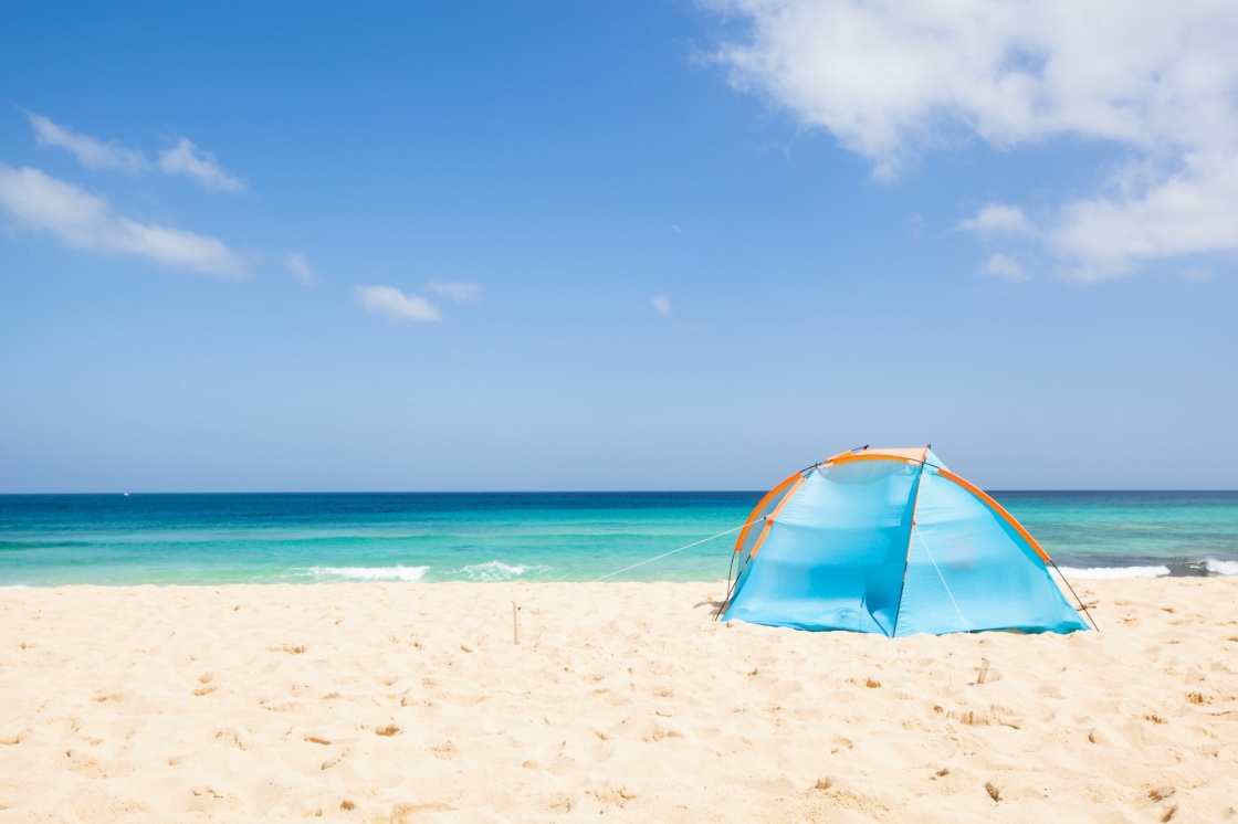 'camping with a tent at a lonesome beach with a turquoise sea and blue sky in the background, Fuerteventura, Canary Islands, Spain, Europe' - Canary Islands